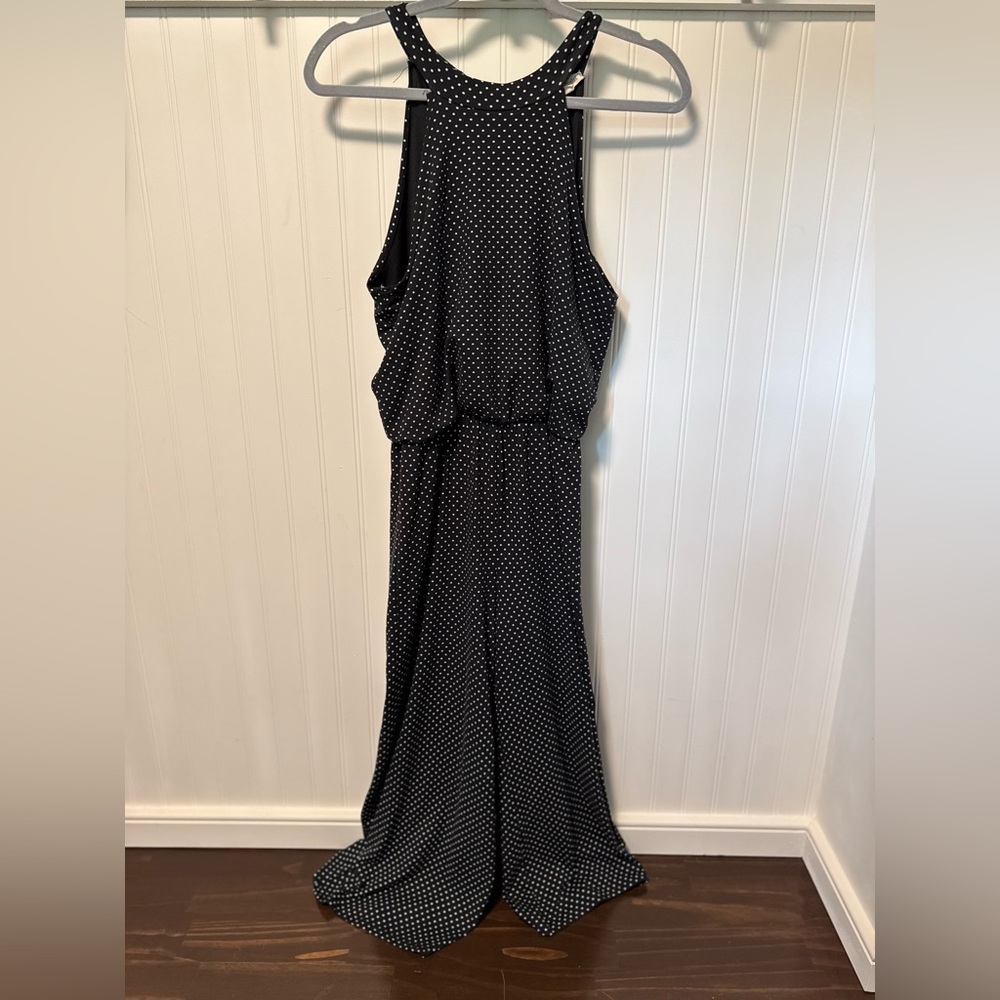 Rolla Coster Black Halter One-piece jumpsuit with white polka dots.